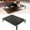 Black elevated pet bed with a dog lying on it, set against a neutral background.